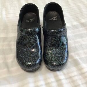 Dansko Black and Tropical Teal Leaf Pattern Clogs 36